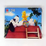 Snoopy and Woodstock plushes lounging on Doghouse Puzzle