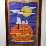 Snoopy laying on Pumpkin Halloween Large Flag