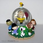 Peanuts Gang carrying Charlie Brown Snow Globe