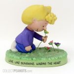 Sally picking Flowers 'Warms the Heart' Figurine