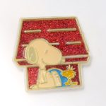 Snoopy & Woodstock sitting in front of doghouse Magnet