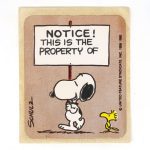 Snoopy carrying sign