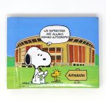 Snoopy signing autographs in front of Stadium Autograph Book