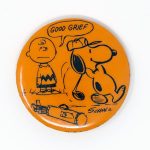 Snoopy golfing with Charlie Brown caddie Button