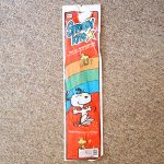 Snoopy and Woodstock dancing with Rainbow Kite