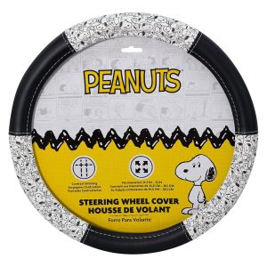Alt text: Peanuts steering wheel cover in original packaging, featuring a black outer ring with a white-and-black Snoopy comic strip pattern along the edge, and a yellow Charlie Brown zig-zag insert showing Snoopy.