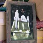 Snoopy sleeping on Doghouse