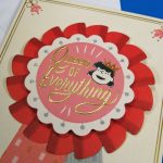 Detail of Lucy "Queen of Everything" Card including gold foil, embossing, glitter and 3-D elements